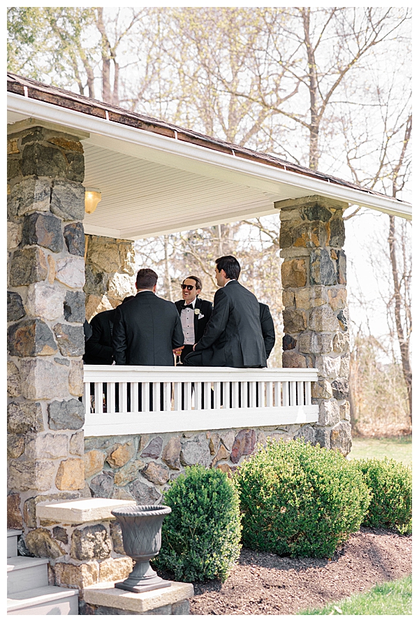 groomsmen hanging outside grooms cottage