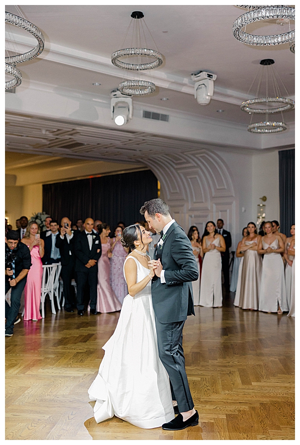 Bride and groom's first dance during their elegant black tie wedding reception
