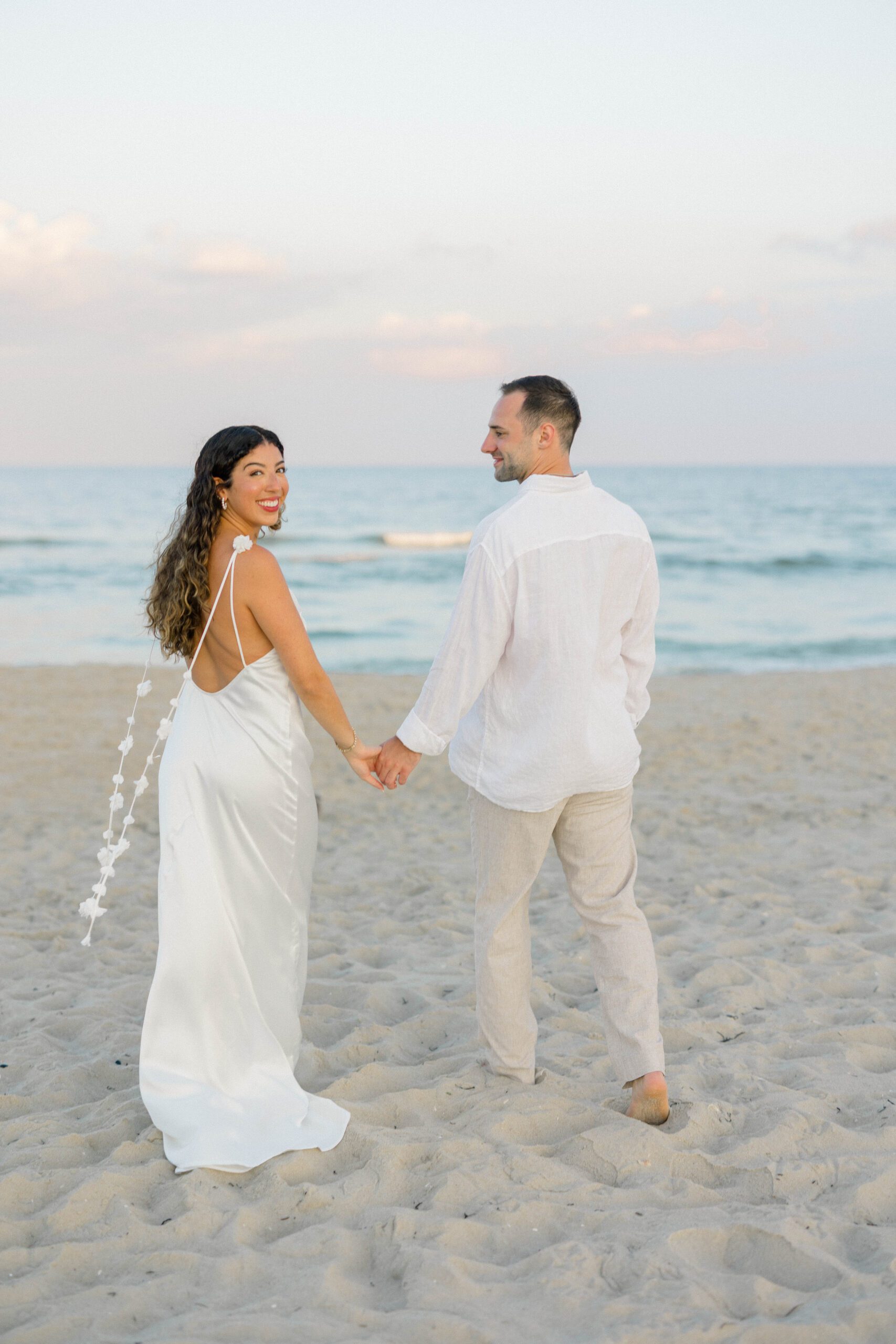 Long Beach Island engagement photographer documents Rachel's formal gown outfit change by the water