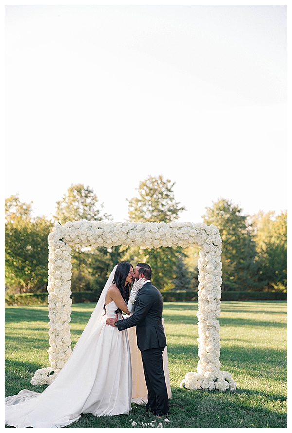 bride and groom first kiss