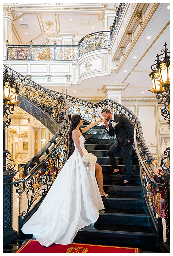 bride and groom on grand staircase