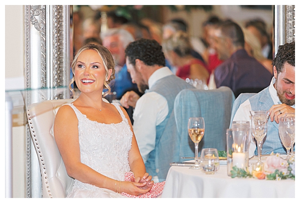 Emotional speech moment at seaside wedding reception