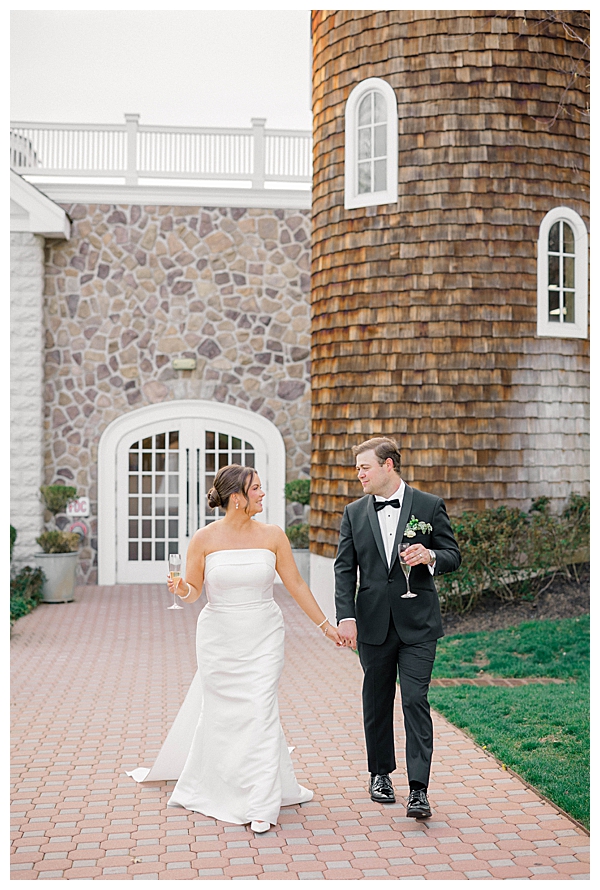 bride and groom in front of coach house Ryland Inn