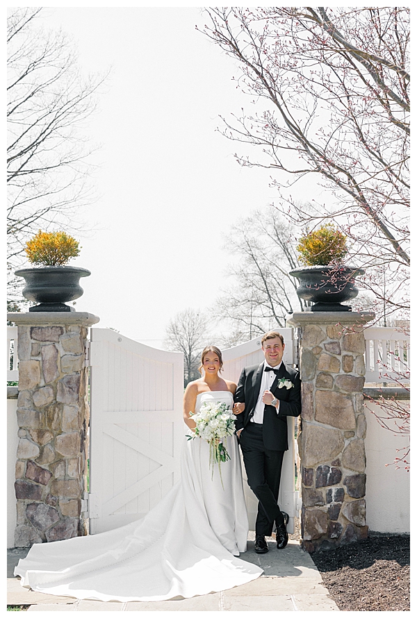 Outdoor portrait session of bride and groom in the Ryland Inn gardens during spring wedding