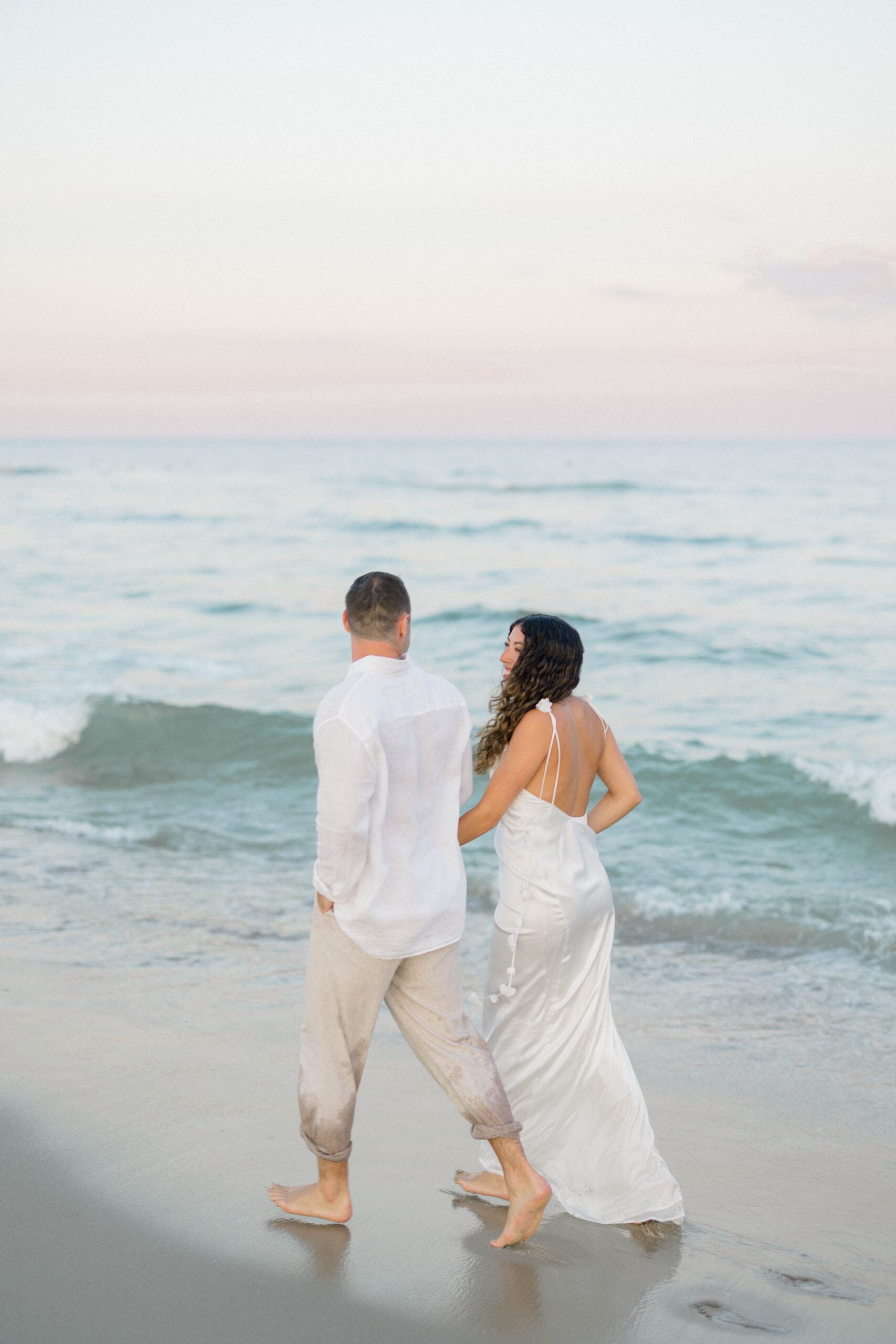 Rachel and Ben biking through LBI beach town streets — Long Beach Island engagement photos