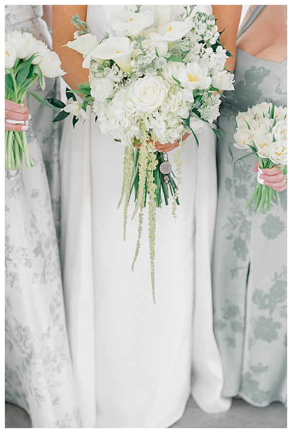 Bridesmaids in light blue dresses posing for portraits at the Ryland Inn in White House Station, NJ