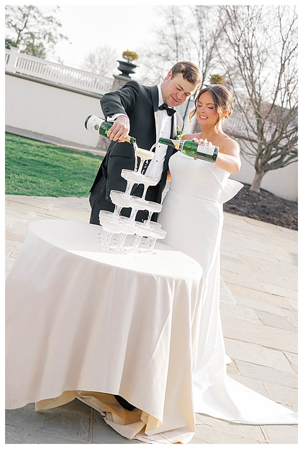 Romantic sunset wedding portraits of the couple on the manicured grounds of the Ryland Inn