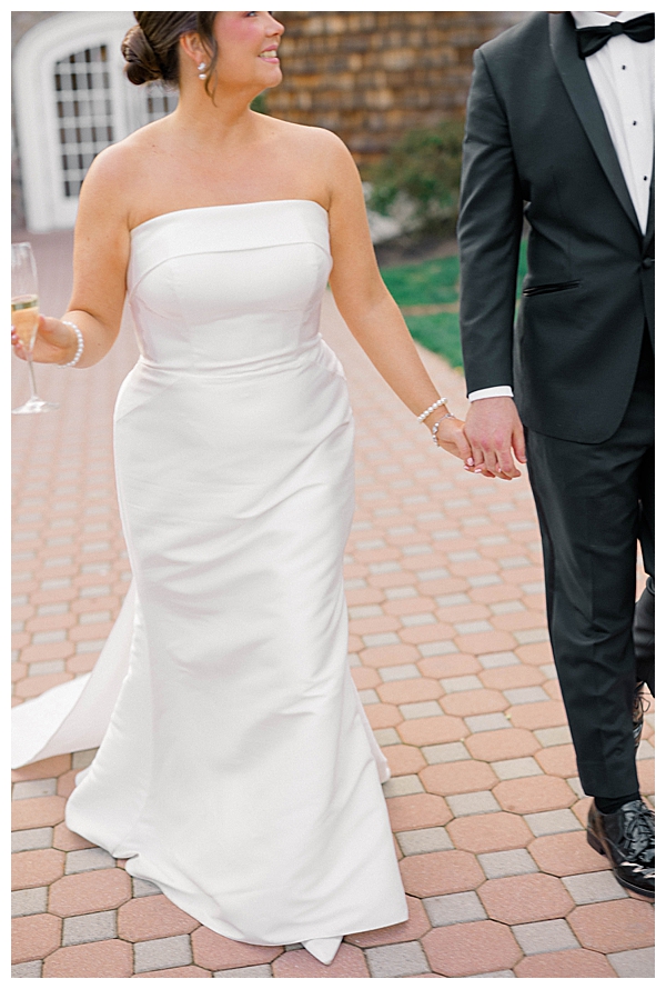 bride and groom holding hands