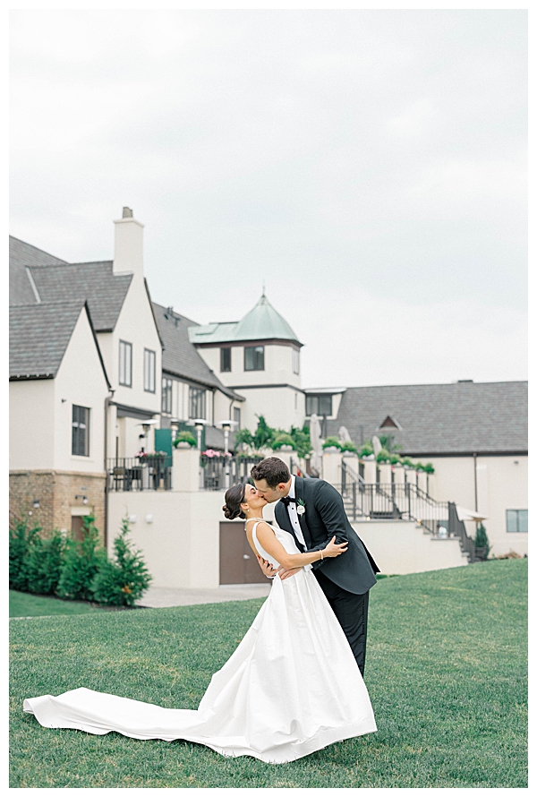 Bride and groom walking the golf course during their wedding day portraits