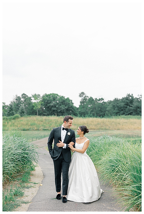 Bride and groom portrait on the golf course at their black tie NJ wedding