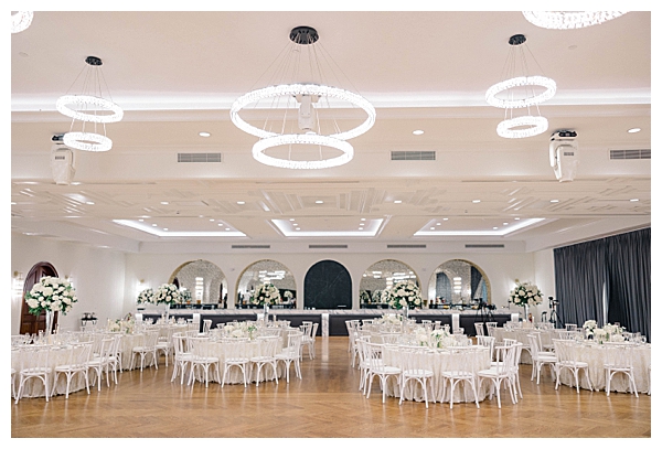 Tilling House Eatontown wedding tablescape with neutral linens and white and green florals