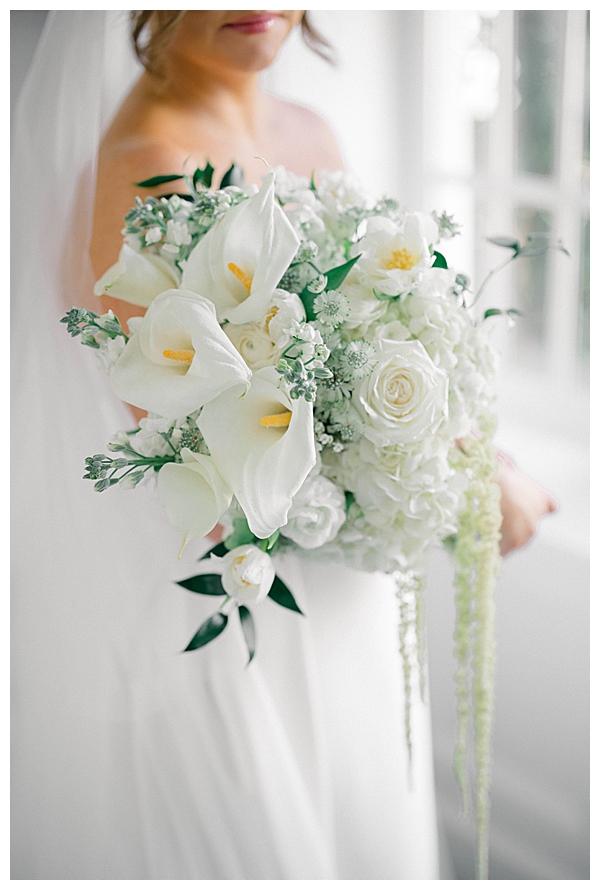 Bride getting ready in the Ryland Inn bridal suite in soft natural light, White House Station, NJ