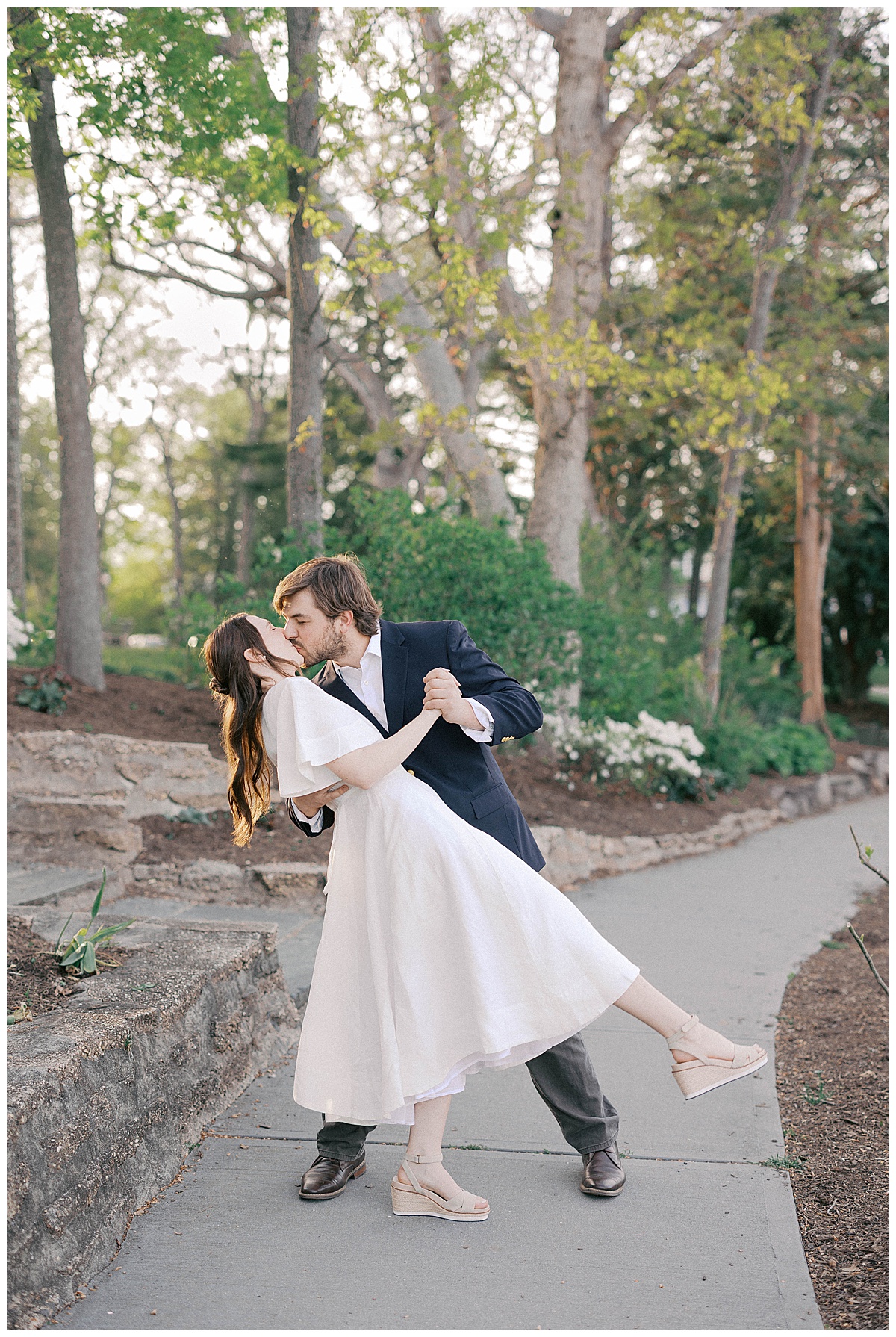 Divine Park lake reflection during engagement session with couple in golden hour light