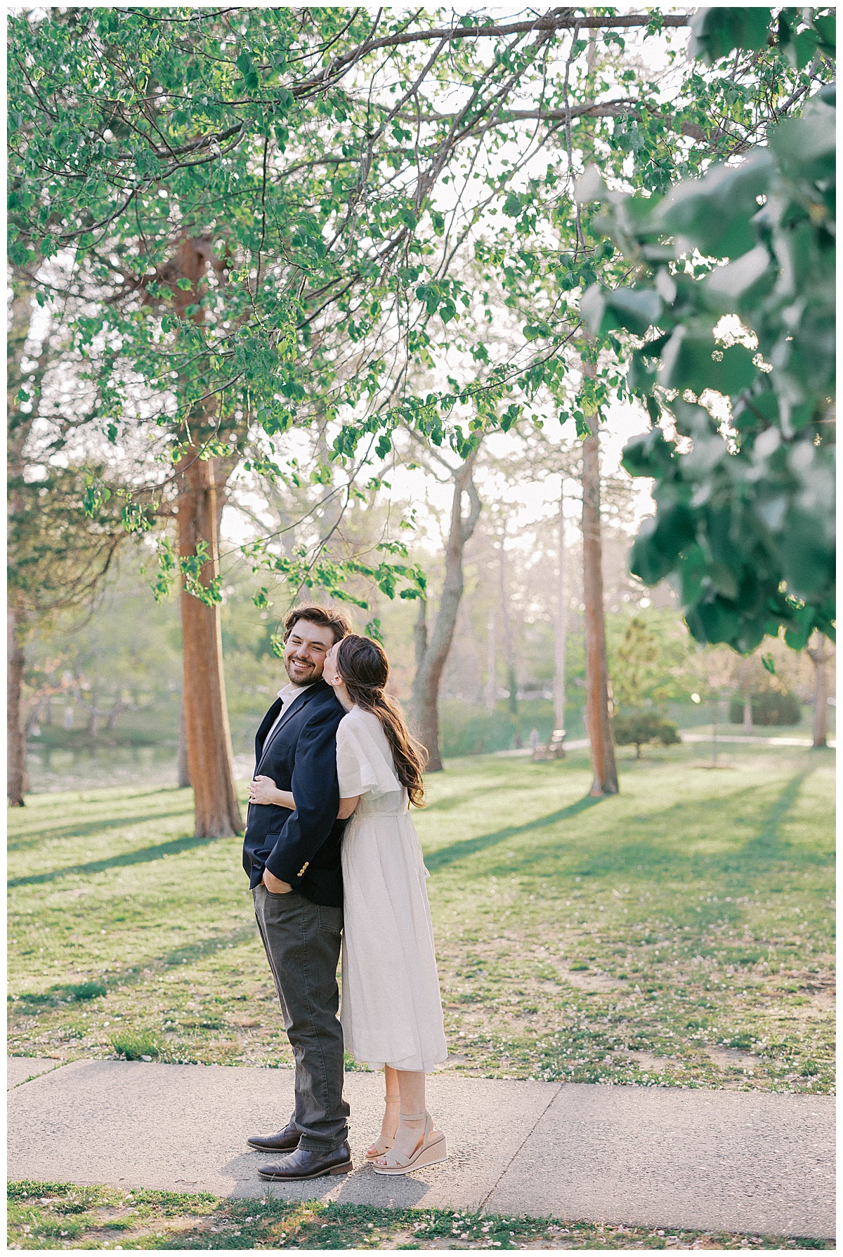 Couple embracing at sunset during Spring Lake NJ engagement session at Divine Park