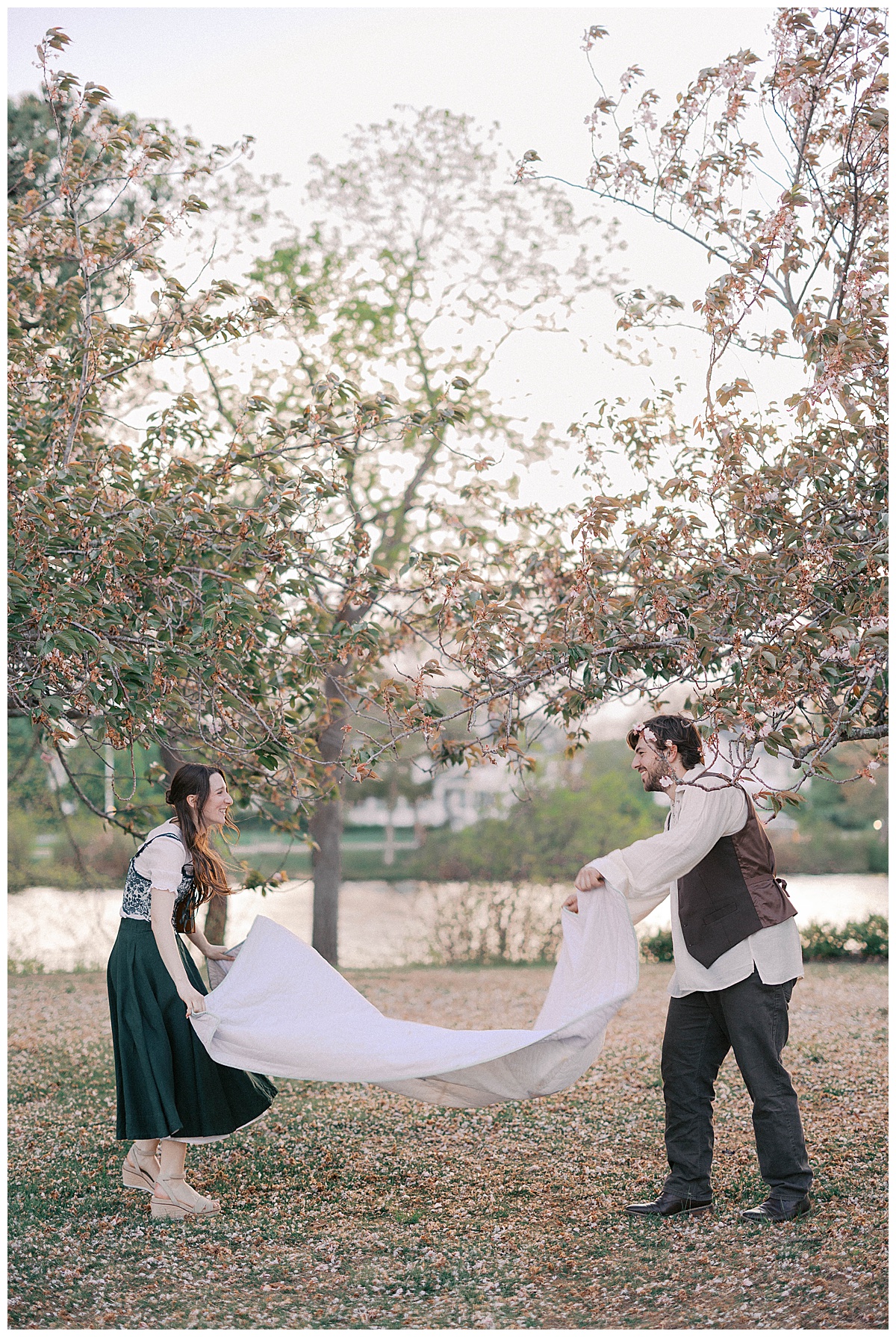 Christie walking through the open lawn at Divine Park evoking a Jane Austen engagement aesthetic