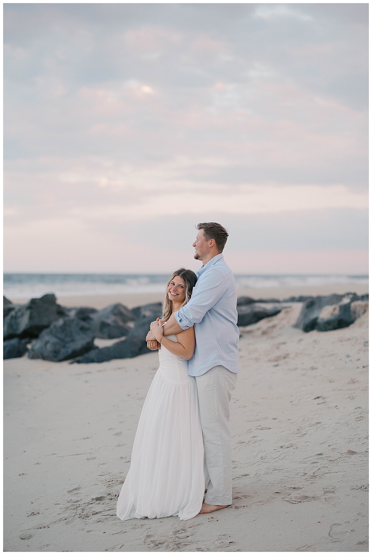 Amanda in her white gown during the romantic first look at Sea Girt beach