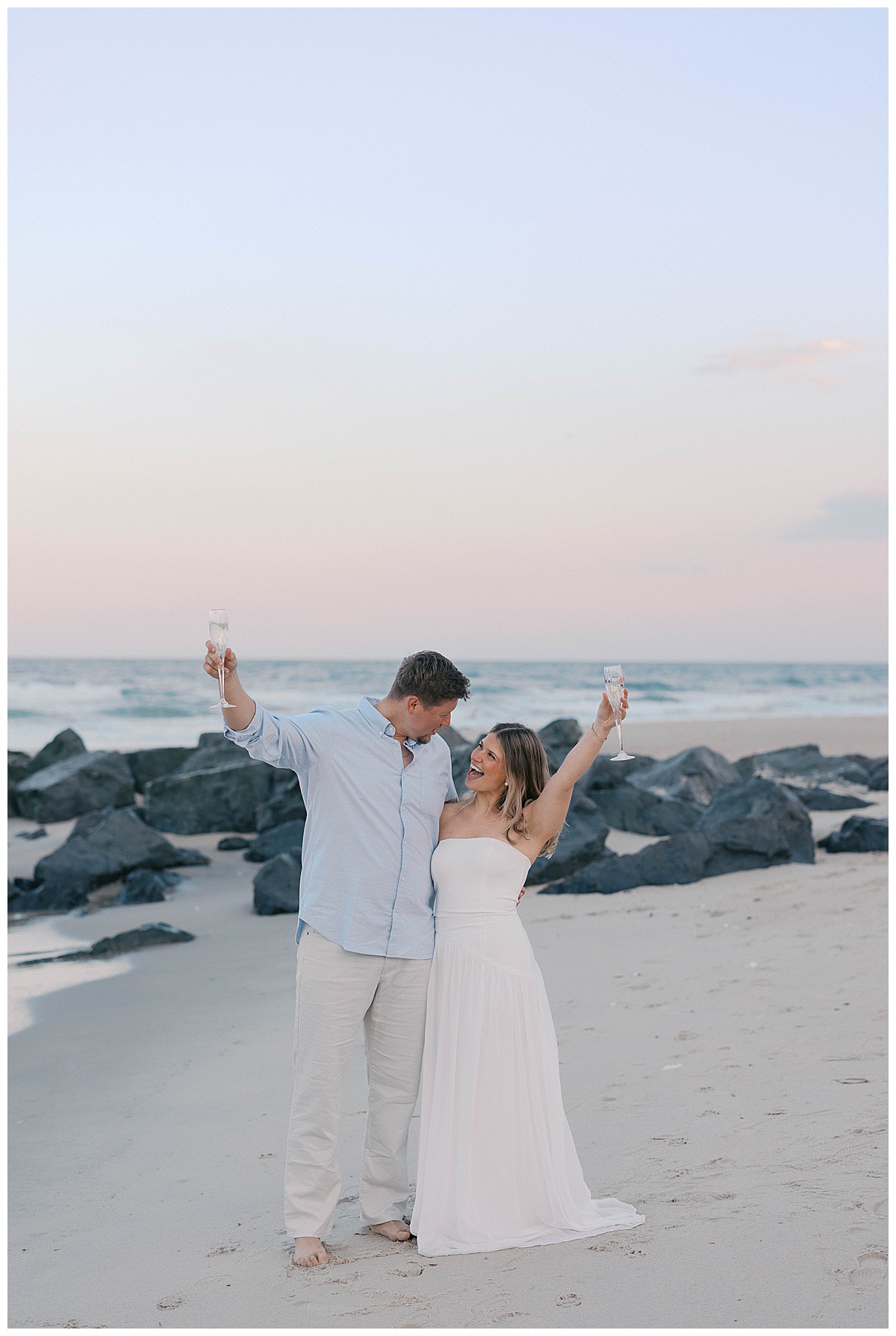NJ beach engagement session featuring two outfit changes at Sea Girt