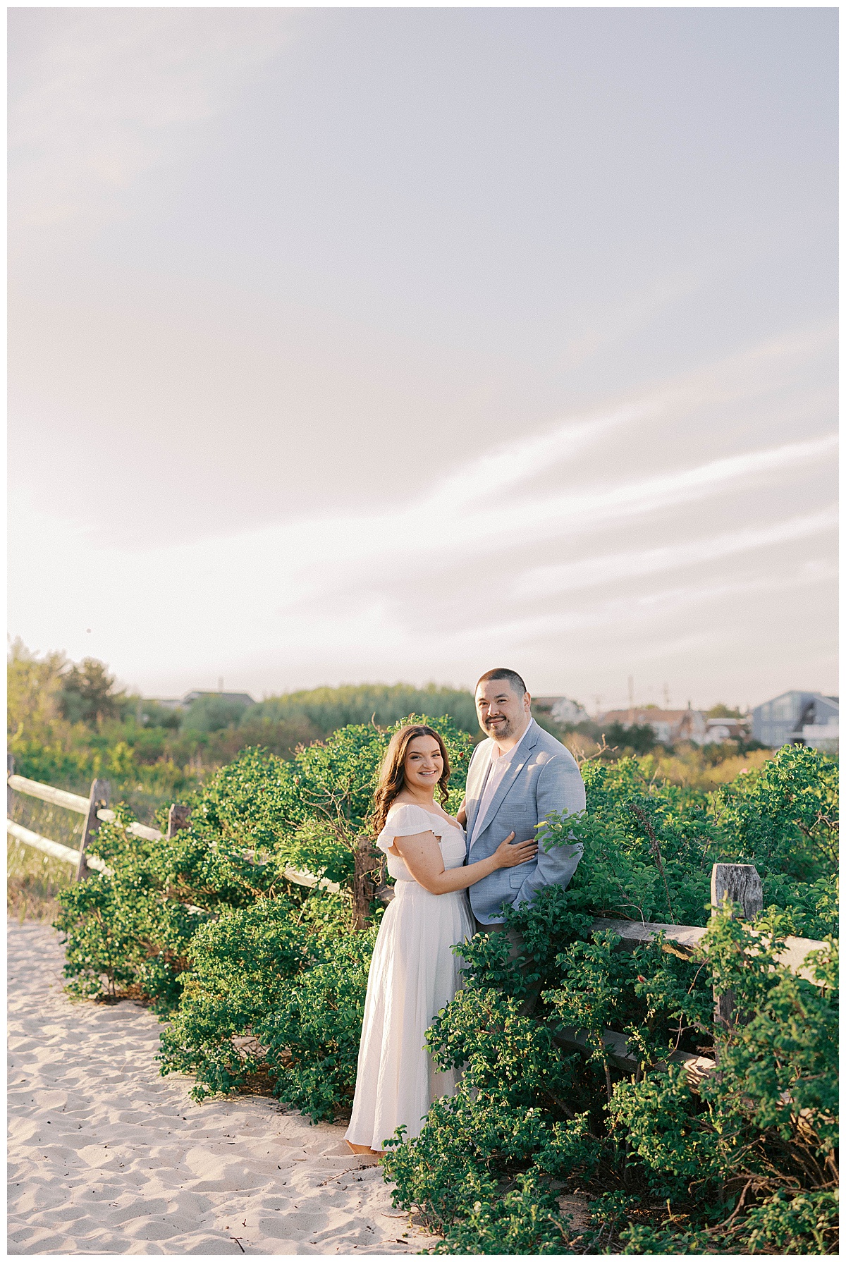 Couple portraits on Sea Girt Beach with soft golden light and ocean waves
