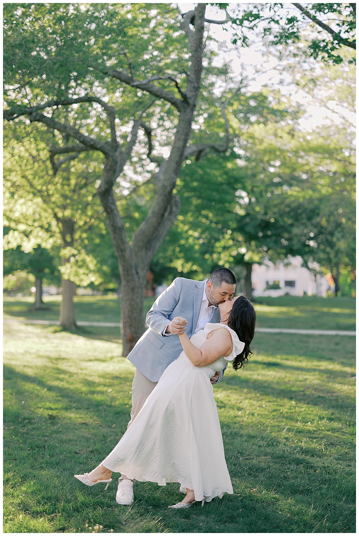 Sunset couple portraits in Spring Lake NJ with glowing sky behind them