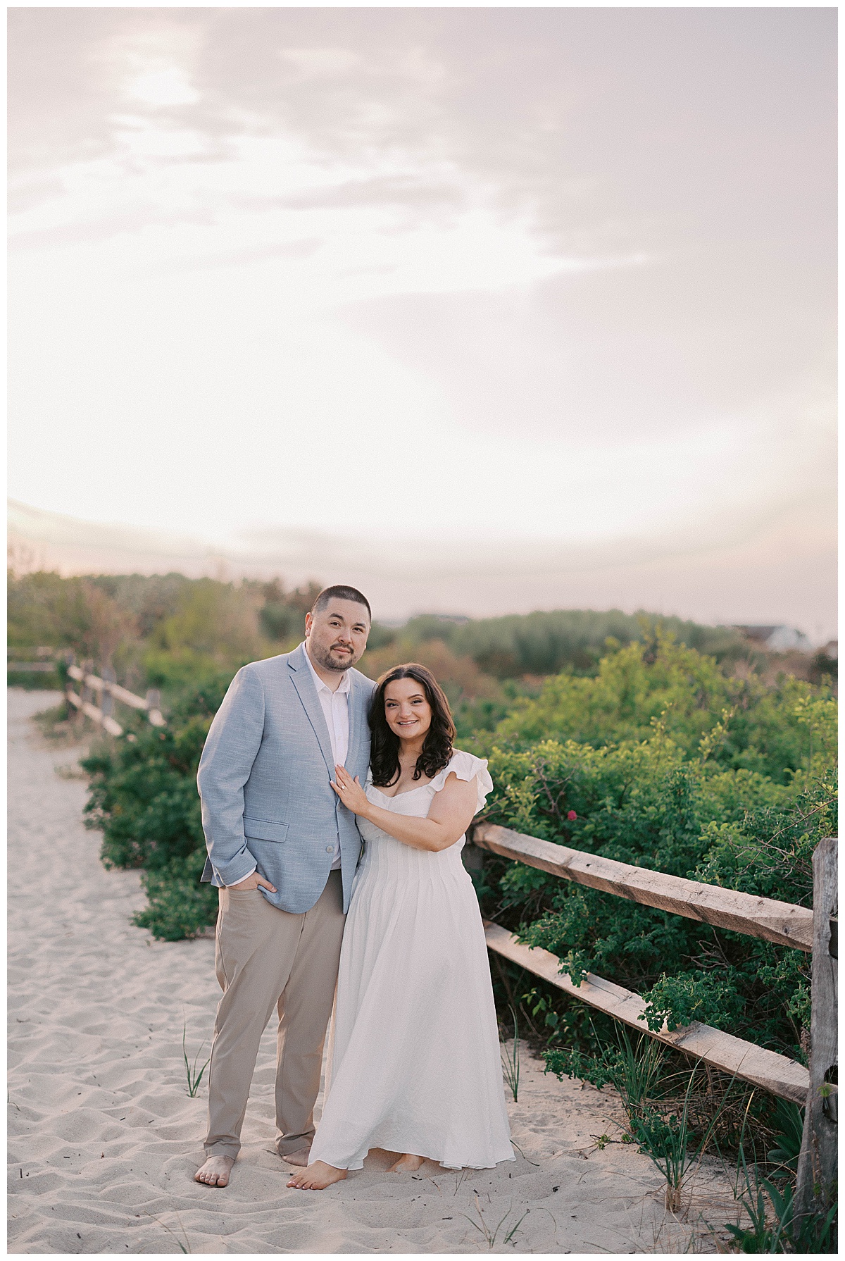 Sea Girt sunset engagement photos with couple silhouetted against the sky
