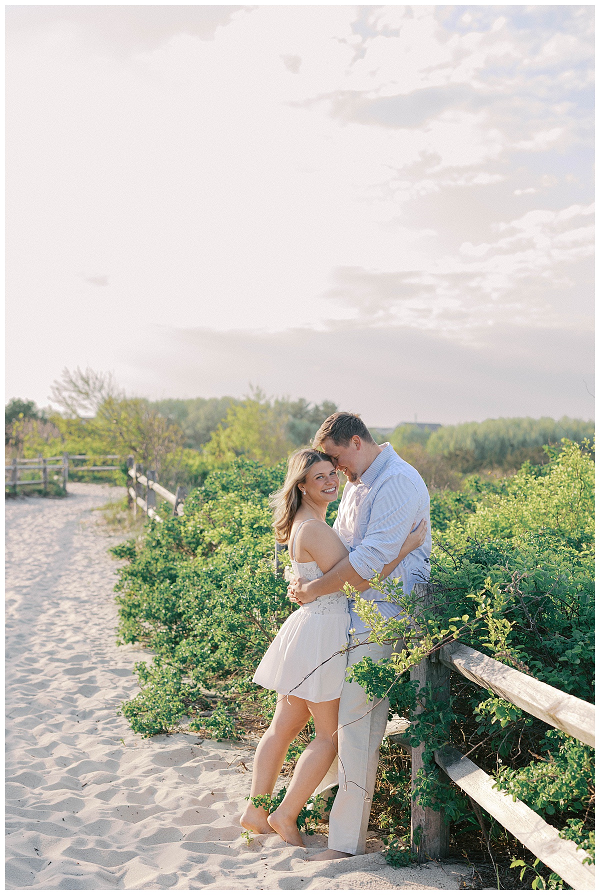 Amanda and Peter walking the shoreline at golden hour in Sea Girt NJ