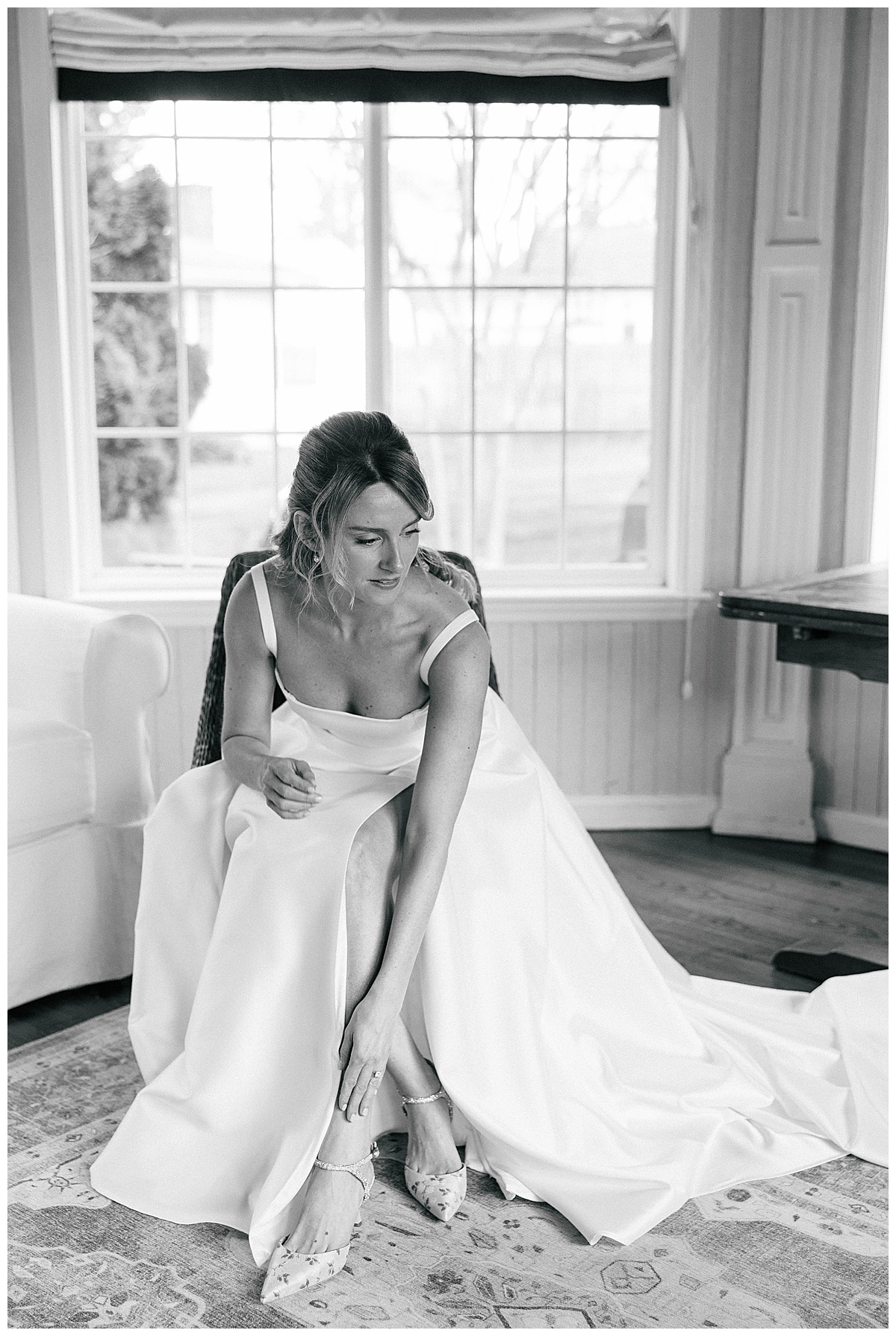 bride putting on shoes 