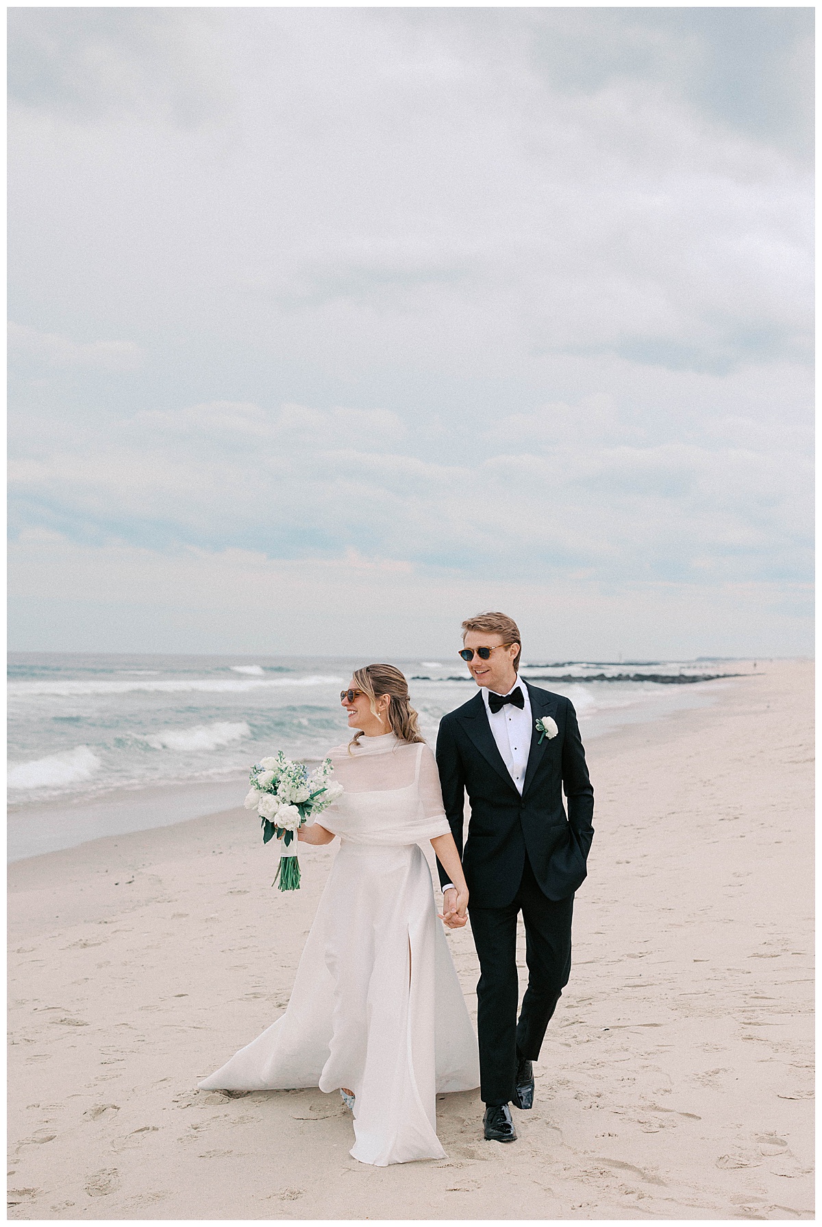 bride and groom on beach at spring lake bath and tennis club
